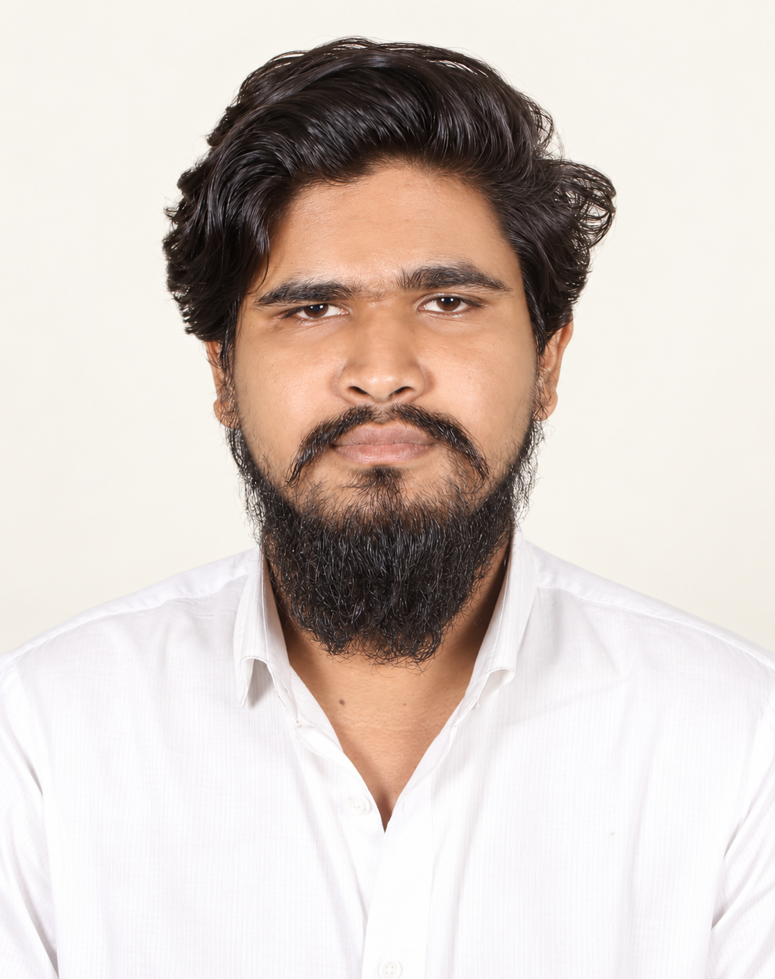 Portrait of Sifat wearing a white shirt against a warm ivory background